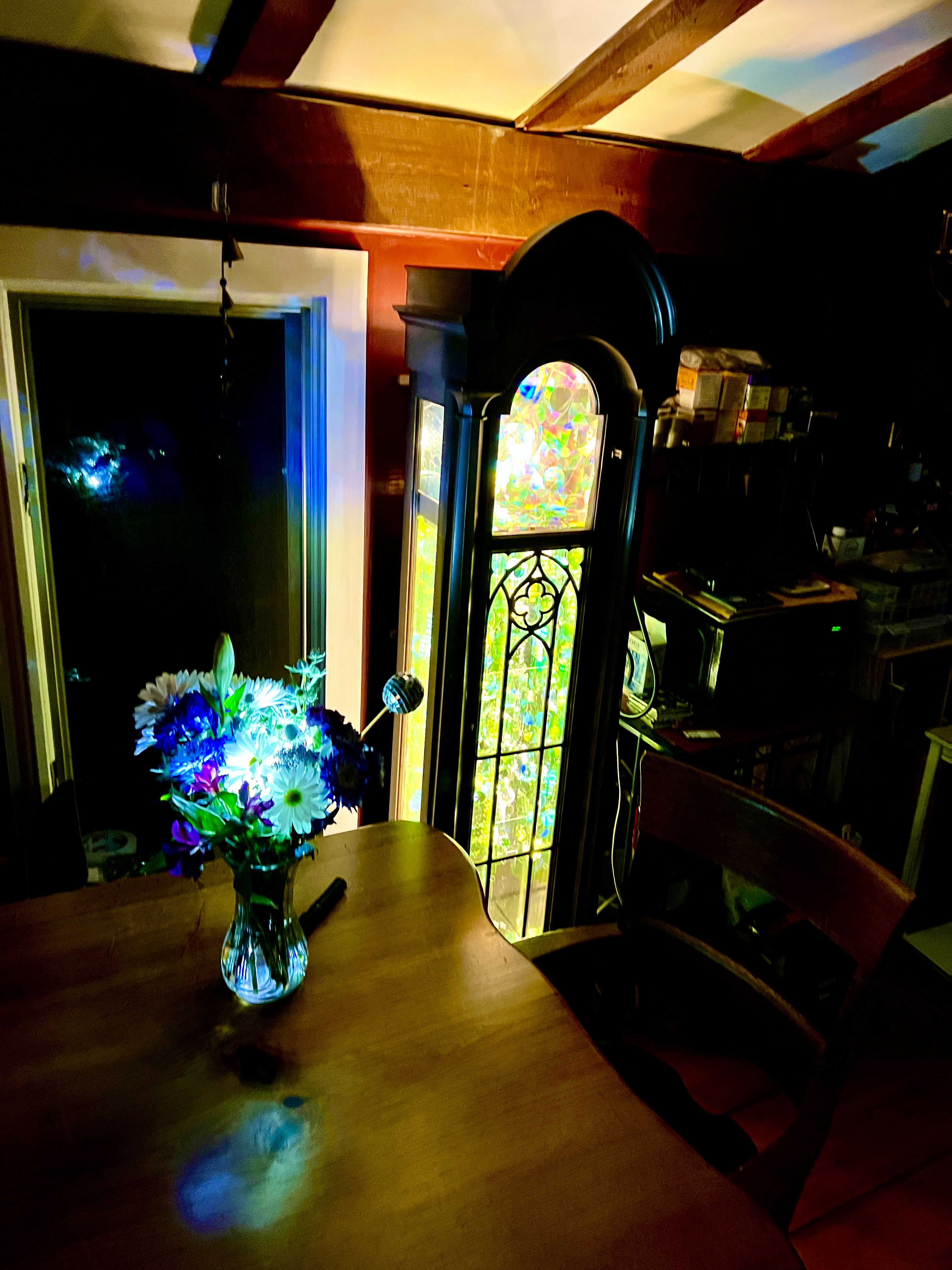 Two glass-disc towers on windowsill with triangle light