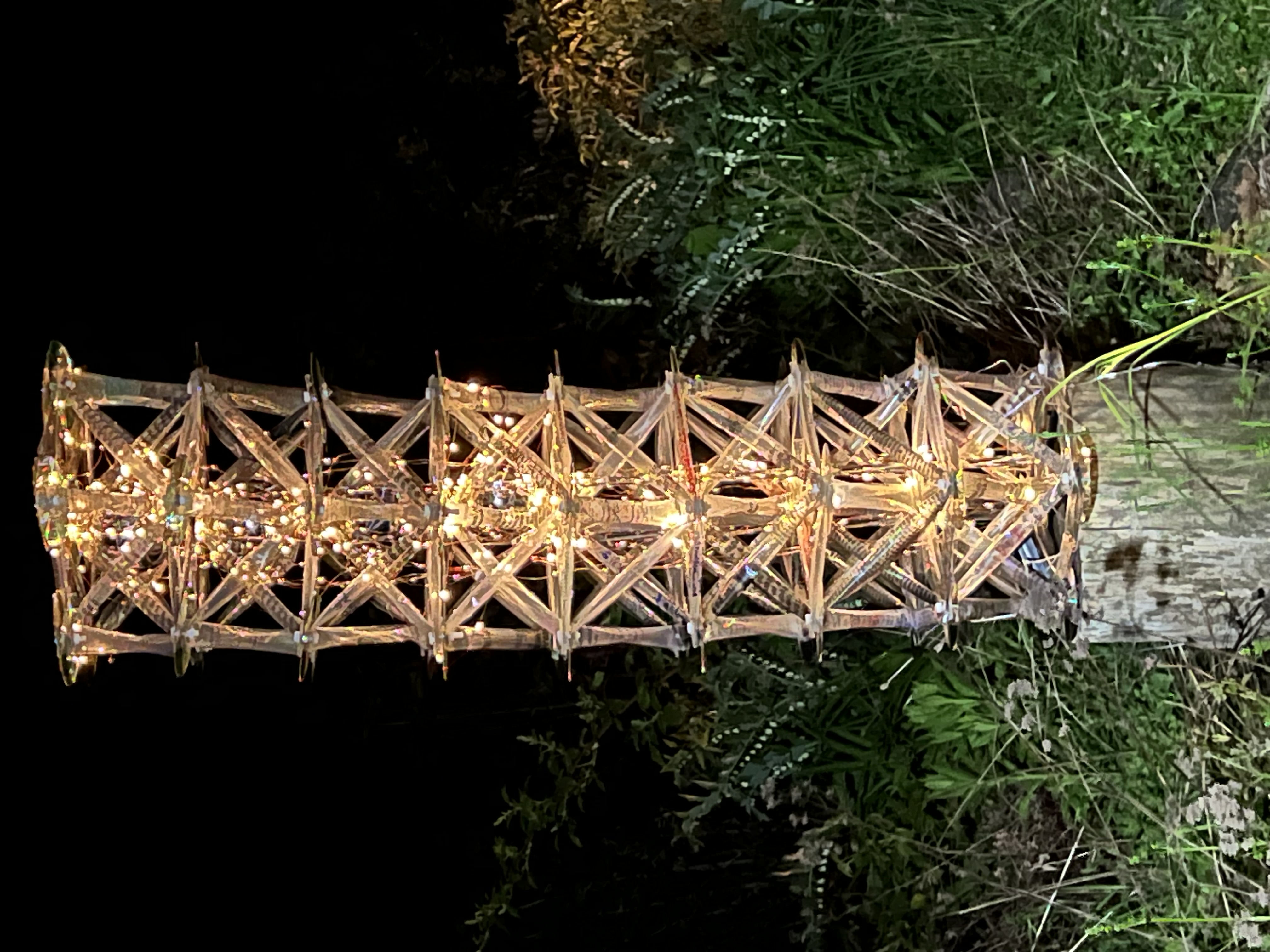 Glowing lattice tower at night